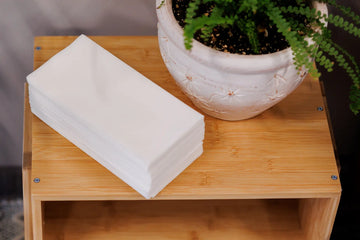 Reference image: Manufacturer lifestyle photo for Nature's Linen 40124 showing the napkin or guest towel in use. Supplied color: white. Decorative folds and display quantities are illustrative; this listing supplies the stated napkins or towels only. Food, beverages, glassware, plates, cutlery, furniture, plants and other props are not included. Dimensions, material, fold and case quantity are as listed above.